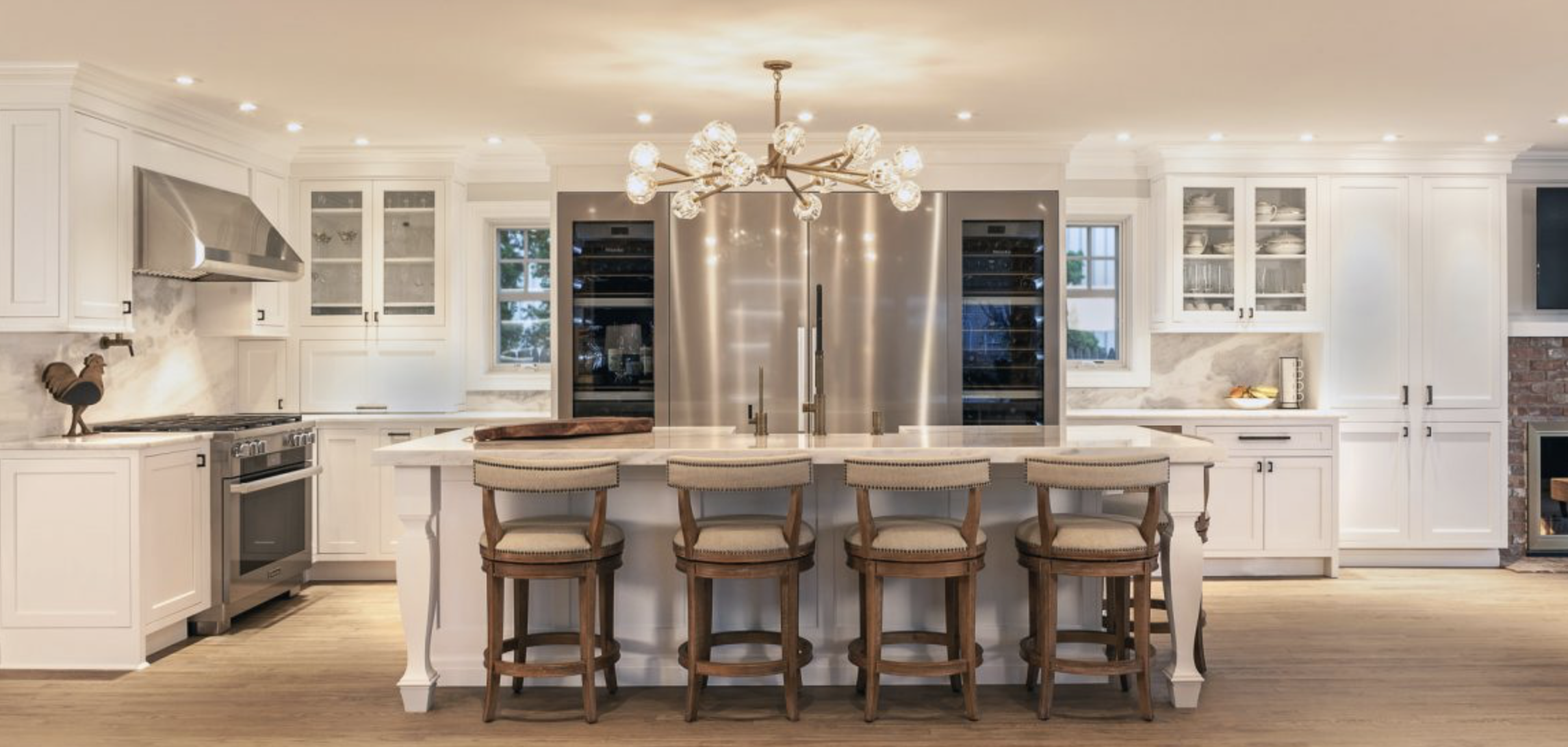 Wall of custom built-in storage in a bright living room