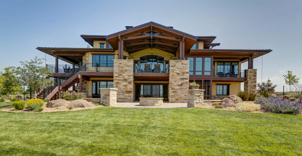 Detailed view of custom cabinetry, brass hardware, and natural stone