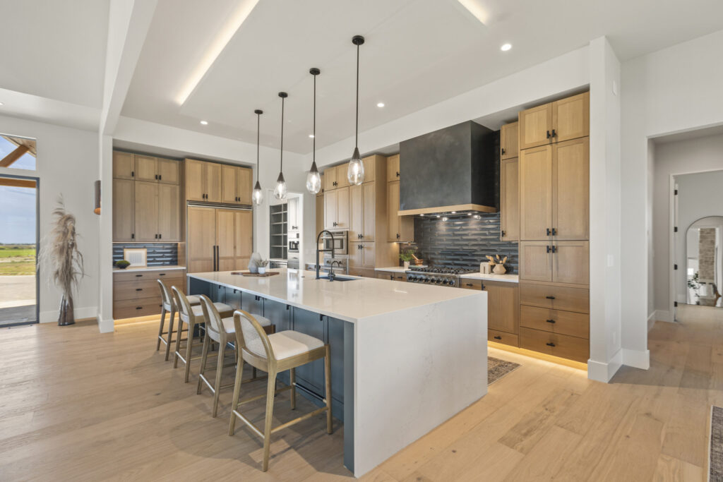 Close-up of dark custom cabinetry with brass hardware