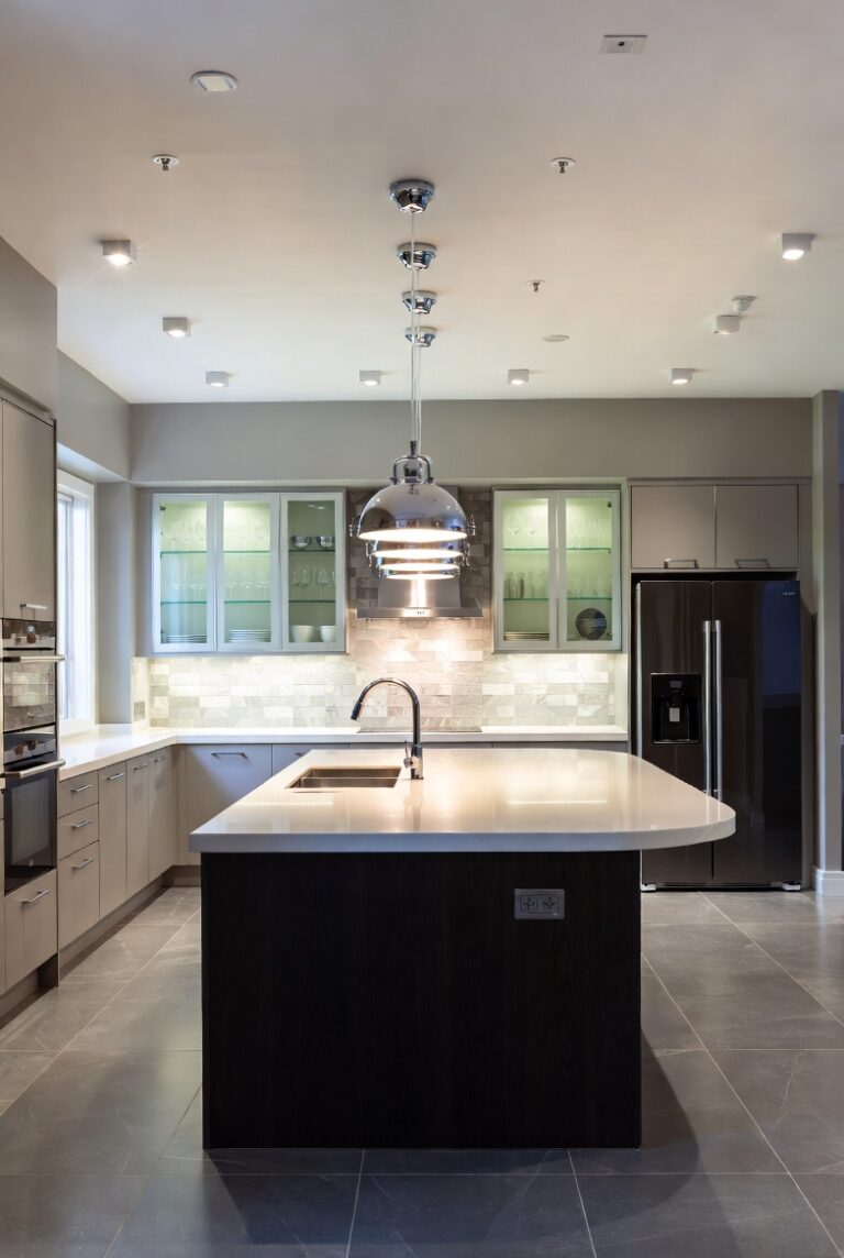 Dark kitchen island paired with crisp white cabinetry